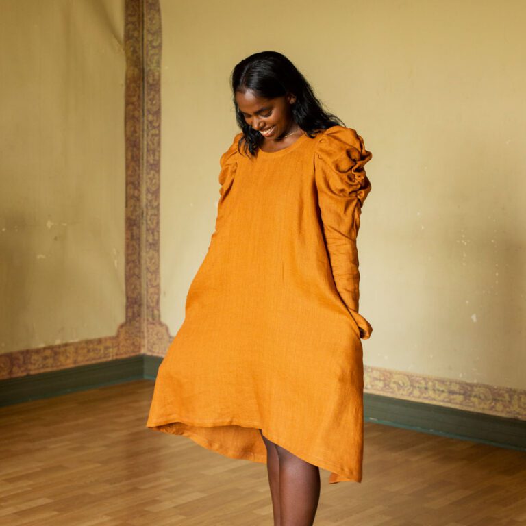 Model wearing yellow Jasmiina dress.