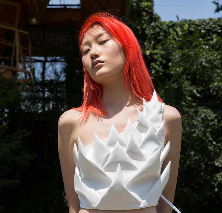 Model wearing a spiked top.